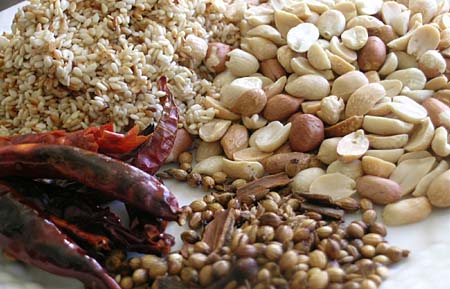 Roasted Peanuts, Sesame Seeds, Red Dry Chillies, Coriander seeds, cumin, cloves, cinnamon.