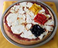 Steelers Pizza with Mozzarella and goat cheese with yellow, red bell peppers and olives as toppings