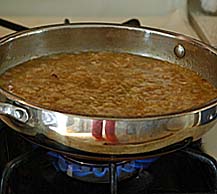Cooked Rice-Dal Mixture is added to Jaggery Syrup